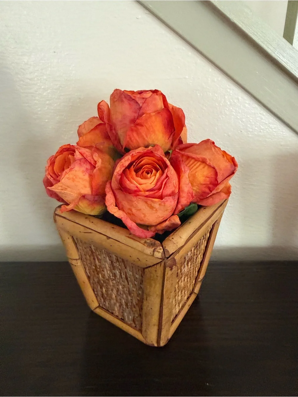 Vibrant Orange Rose Bouquet in Woven Planter